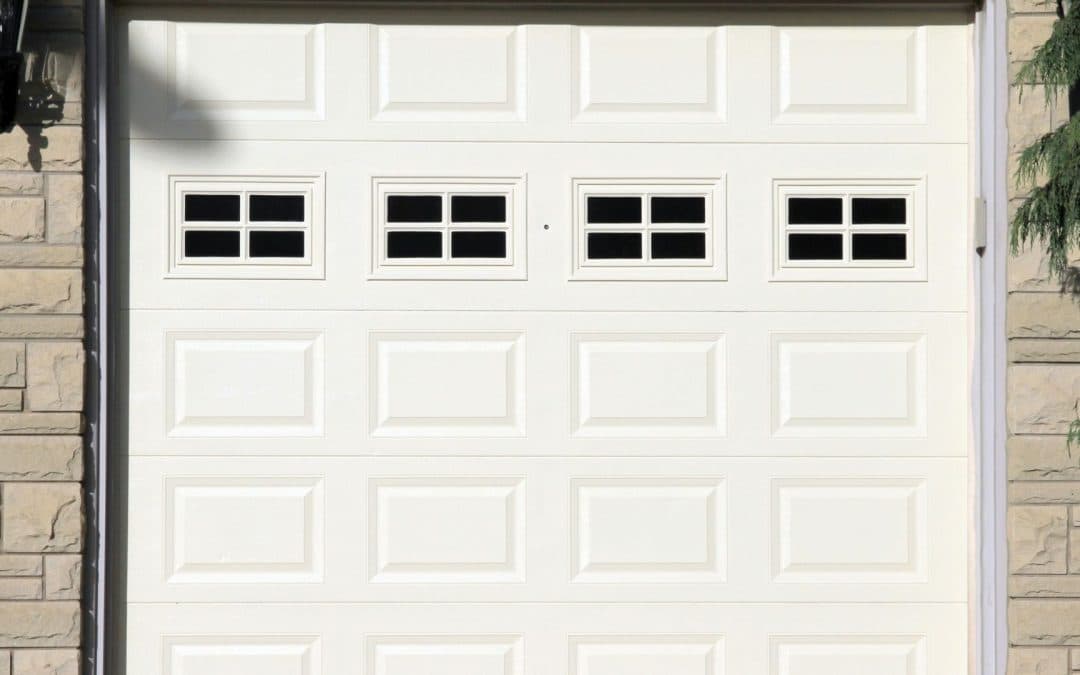 A white garage door that contains the best garage door insulation